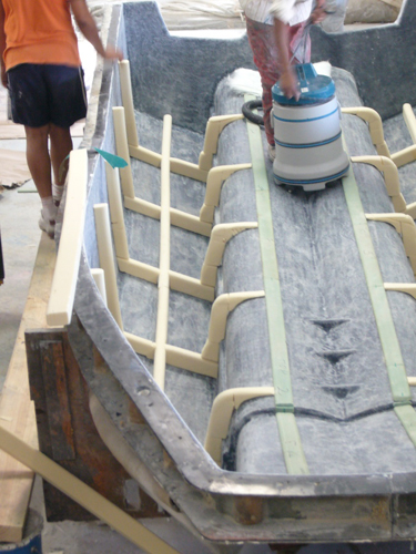Composite lamination work on an M2 hull structure
